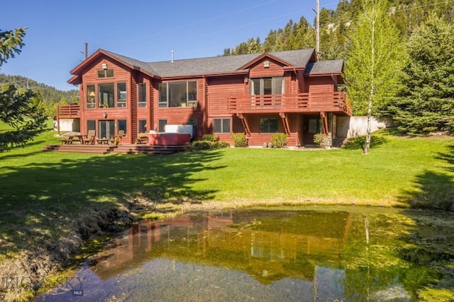 48042 Gallatin Rd, Big Sky, MT 59730 - back of property with a wooden deck, a yard, and a shingled roof