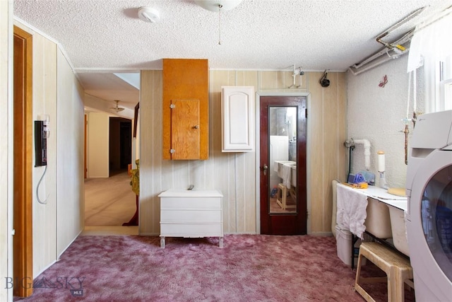 510 S Excelsior, Butte, MT 59701 - laundry room featuring a textured ceiling, carpet, and stacked washer and clothes dryer