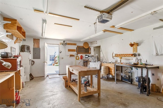 510 S Excelsior, Butte, MT 59701 - garage with electric panel, a garage door opener, and a workshop area