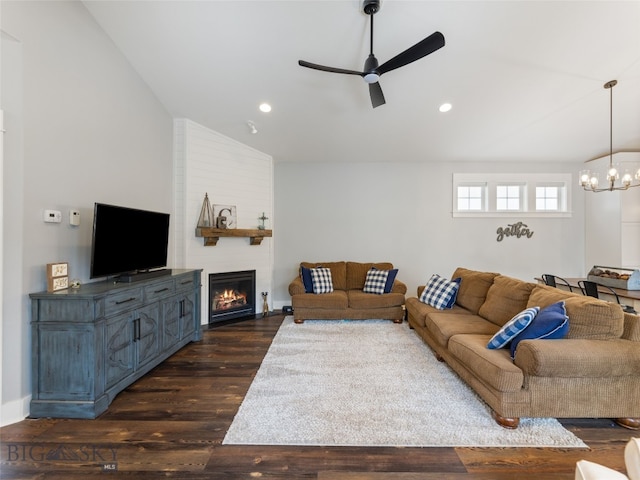 3171 Spring Ridge Dr, Bozeman, MT 59715 - living room featuring vaulted ceiling, ceiling fan, a chandelier, dark wood-type flooring, and a large fireplace