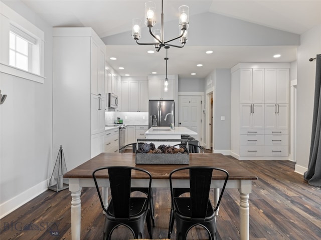 3171 Spring Ridge Dr, Bozeman, MT 59715 - dining room featuring lofted ceiling, a chandelier, dark wood-style flooring, and recessed lighting