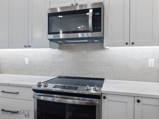 3171 Spring Ridge Dr, Bozeman, MT 59715 - kitchen featuring stainless steel appliances and white cabinetry