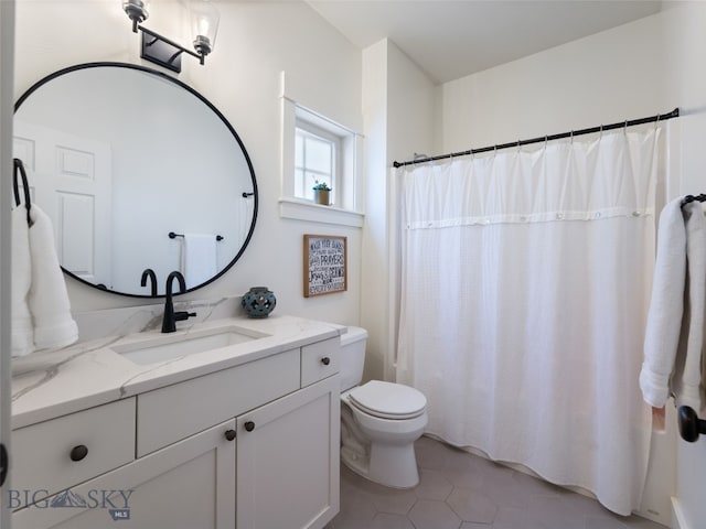 3171 Spring Ridge Dr, Bozeman, MT 59715 - bathroom featuring vanity, tile patterned floors, and shower / bath combo with shower curtain