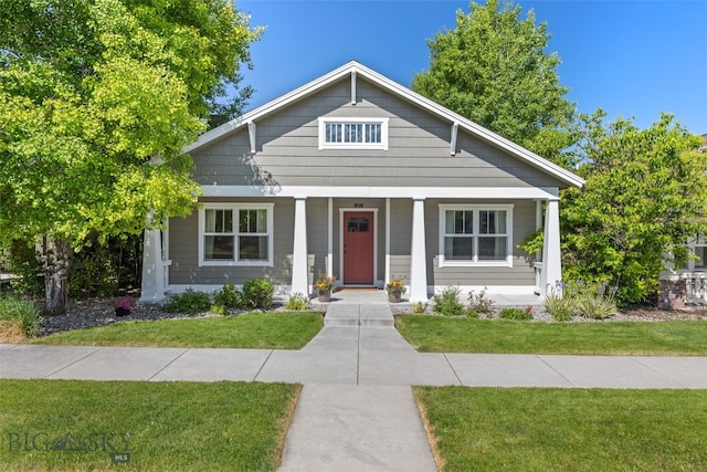3171 Spring Ridge Dr, Bozeman, MT 59715 - bungalow-style house with a porch and a front yard