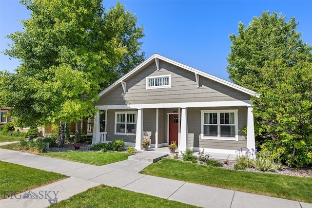 3171 Spring Ridge Dr, Bozeman, MT 59715 - view of front of property featuring a porch and a front lawn