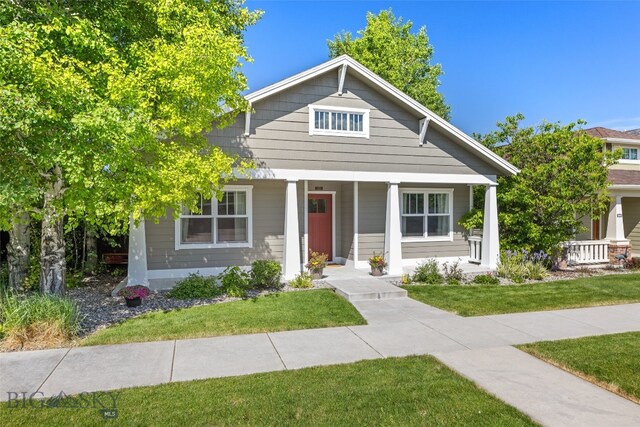 3171 Spring Ridge Dr, Bozeman, MT 59715 - bungalow featuring covered porch and a front yard