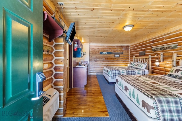 701 Bauer Ln Unit 2, Ennis, MT 59729 - bedroom featuring log walls, hardwood / wood-style flooring, and wood ceiling