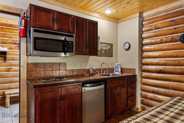 701 Bauer Ln Unit 2, Ennis, MT 59729 - kitchen with appliances with stainless steel finishes, rustic walls, a sink, dark countertops, and wooden ceiling