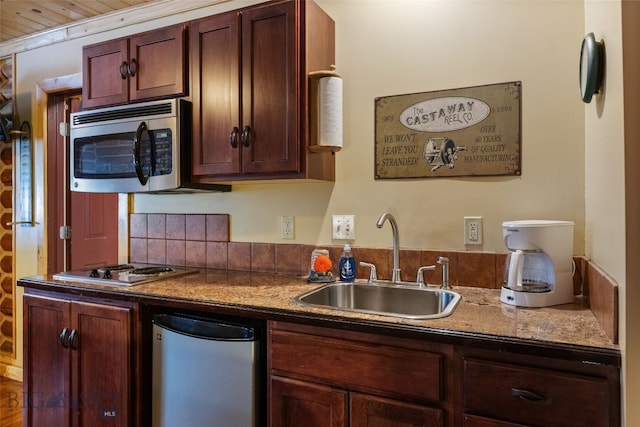701 Bauer Ln Unit 2, Ennis, MT 59729 - kitchen with stainless steel appliances, a sink, decorative backsplash, and dark countertops