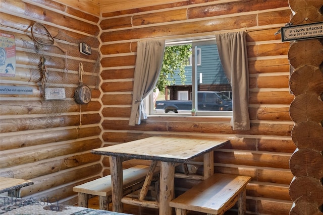 701 Bauer Ln Unit 2, Ennis, MT 59729 - unfurnished dining area with log walls