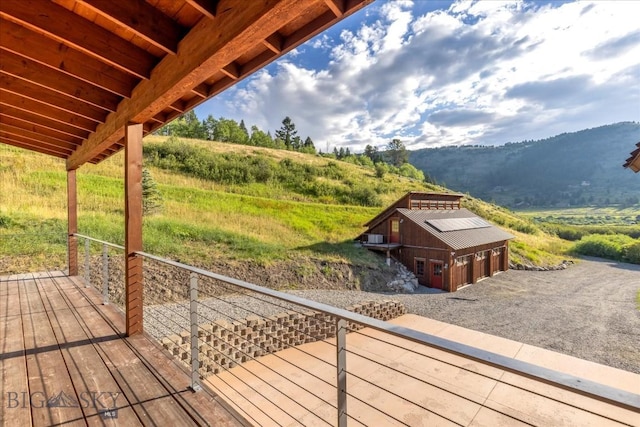 3011 Goose Creek Rd, Bozeman, MT 59715 - deck with a detached garage, a mountain view, and an outdoor structure