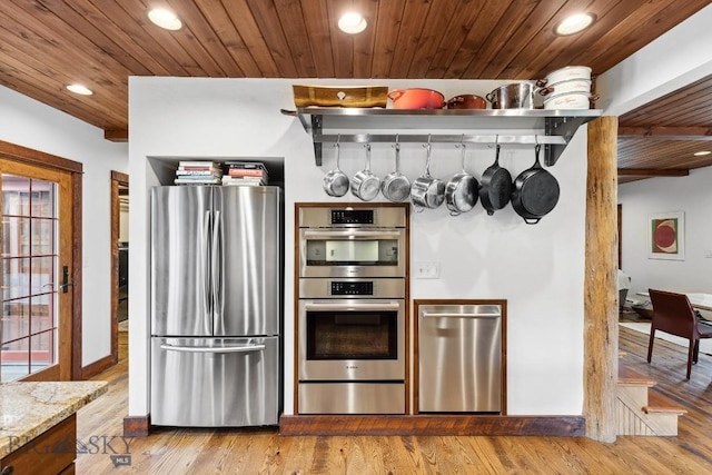 3011 Goose Creek Rd, Bozeman, MT 59715 - kitchen featuring stainless steel appliances, recessed lighting, light wood-style flooring, wooden ceiling, and light stone counters