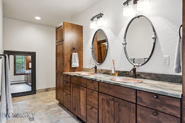 3011 Goose Creek Rd, Bozeman, MT 59715 - full bathroom with baseboard heating, double vanity, baseboards, and recessed lighting