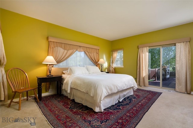 505 E Granite, Bozeman, MT 59718 - bedroom featuring access to outside and light carpet