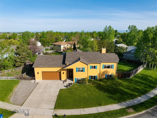 505 E Granite, Bozeman, MT 59718 - view of front facade with a garage, concrete driveway, a chimney, and central AC unit