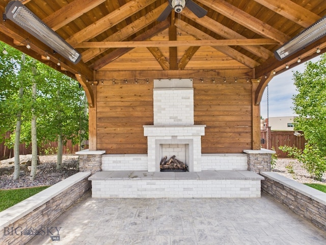 3405 W Fieldstone Dr, Bozeman, MT 59715 - view of patio featuring an outdoor brick fireplace and a gazebo