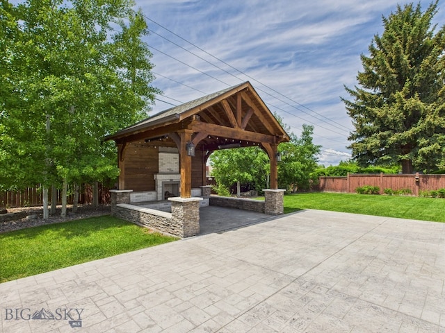 3405 W Fieldstone Dr, Bozeman, MT 59715 - view of patio with an outdoor stone fireplace and a gazebo