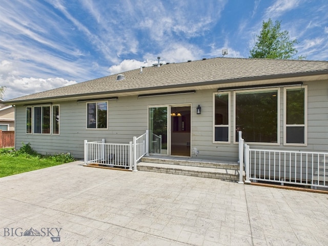 3405 W Fieldstone Dr, Bozeman, MT 59715 - back of house featuring a patio area and a shingled roof