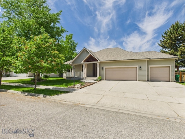 3405 W Fieldstone Dr, Bozeman, MT 59715 - view of front of home featuring a garage, concrete driveway, a front lawn, and a porch