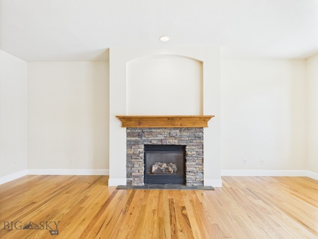 3405 W Fieldstone Dr, Bozeman, MT 59715 - unfurnished living room with wood finished floors, a fireplace, and baseboards