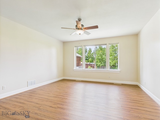3405 W Fieldstone Dr, Bozeman, MT 59715 - unfurnished room featuring ceiling fan, wood finished floors, and baseboards