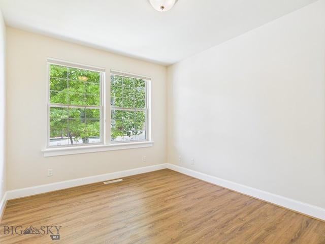 3405 W Fieldstone Dr, Bozeman, MT 59715 - spare room with healthy amount of natural light, baseboards, and light wood-type flooring