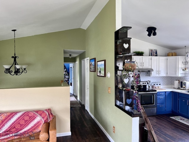 616 Comet, Livingston, MT 59047 - kitchen featuring vaulted ceiling, stainless steel electric range, blue cabinets, white cabinetry, and a chandelier