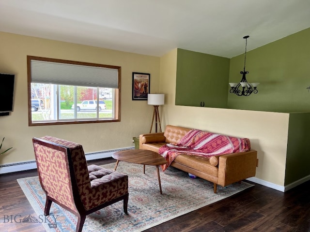 616 Comet, Livingston, MT 59047 - living area with baseboard heating, wood finished floors, a chandelier, baseboards, and vaulted ceiling