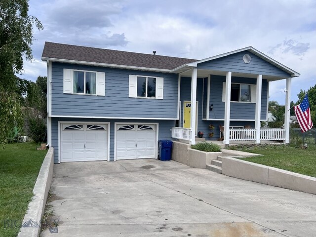 616 Comet, Livingston, MT 59047 - bi-level home with covered porch, a garage, driveway, a front lawn, and roof with shingles