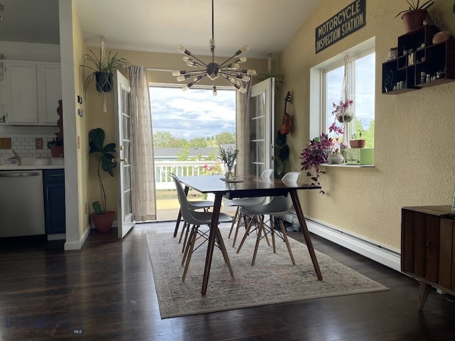 616 Comet, Livingston, MT 59047 - dining area featuring a textured wall, a chandelier, dark wood finished floors, baseboards, and a baseboard radiator