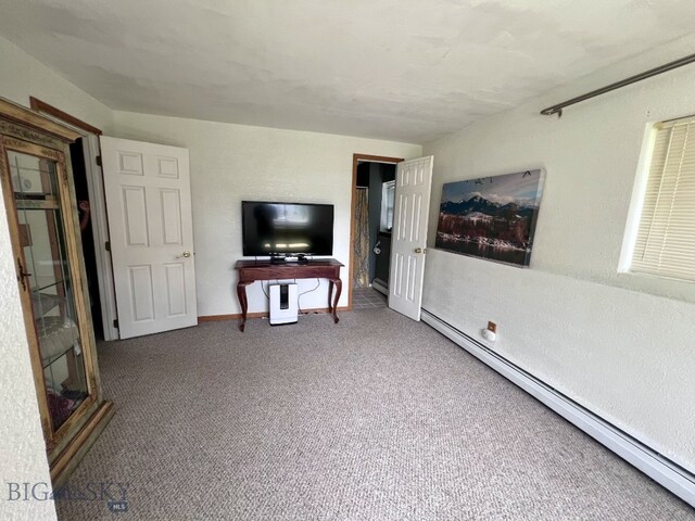 616 Comet, Livingston, MT 59047 - unfurnished living room featuring baseboard heating, carpet, baseboards, and a textured wall