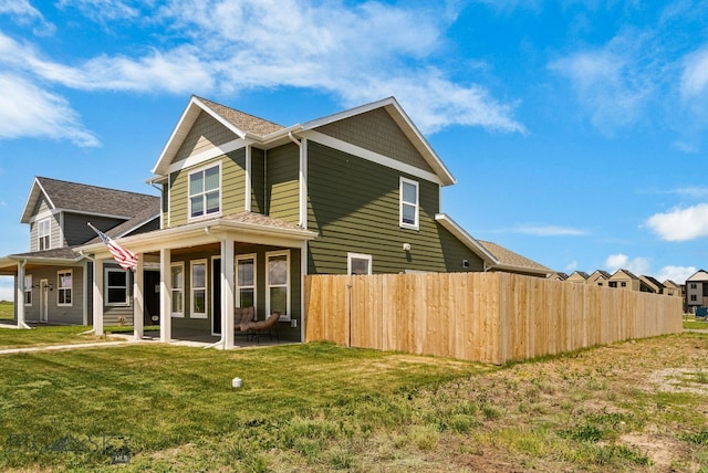 903 Arnold, Bozeman, MT 59715 - view of home's exterior with a patio and roof with shingles