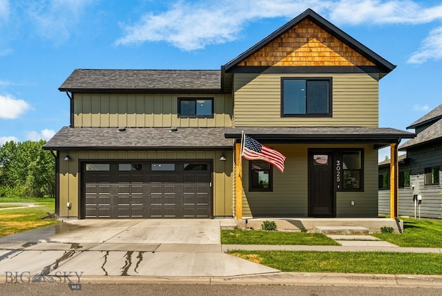 2600 S 11th, Bozeman, MT 59715 - view of front of home with board and batten siding, driveway, a garage, and covered porch