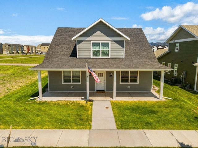 915 Arnold, Bozeman, MT 59715 - bungalow featuring central AC unit, a front lawn, and roof with shingles