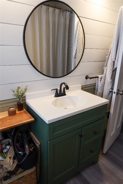 1905 Florence Ave, Butte, MT 59701 - bathroom with vanity, wood finished floors, and wood walls