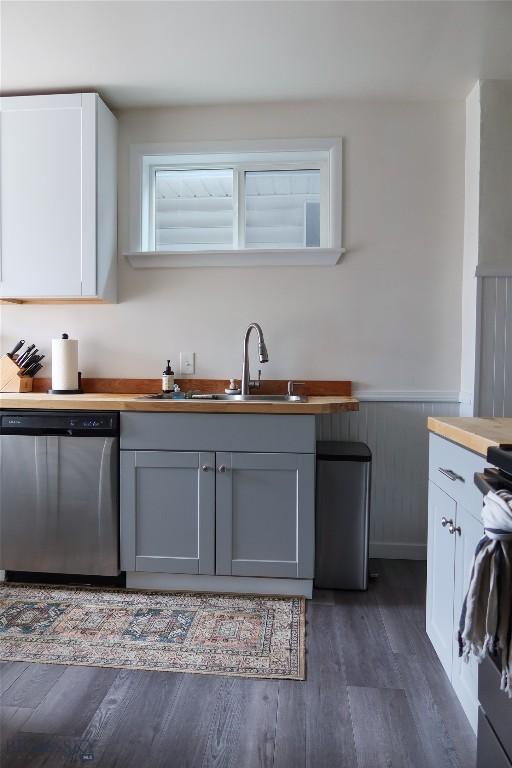 1905 Florence Ave, Butte, MT 59701 - kitchen with dishwasher, dark wood finished floors, a sink, gray cabinets, and wainscoting