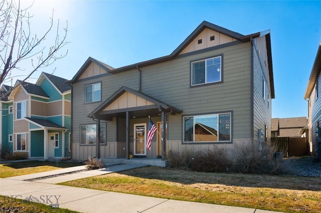 3650 Potosi St, Bozeman, MT 59718 - view of front of house with board and batten siding and a front lawn