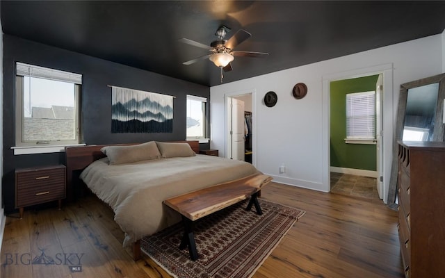 3650 Potosi St, Bozeman, MT 59718 - bedroom with hardwood / wood-style flooring, baseboards, a spacious closet, and ceiling fan