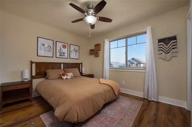 3650 Potosi St, Bozeman, MT 59718 - bedroom with baseboards, wood finished floors, and a ceiling fan