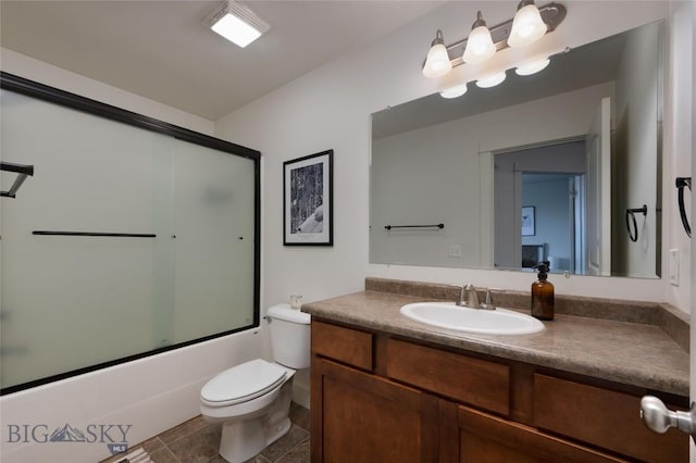 3650 Potosi St, Bozeman, MT 59718 - full bathroom featuring vanity, toilet, combined bath / shower with glass door, and tile patterned flooring