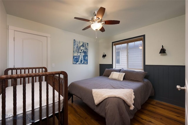 3650 Potosi St, Bozeman, MT 59718 - bedroom with wood finished floors, a wainscoted wall, and ceiling fan