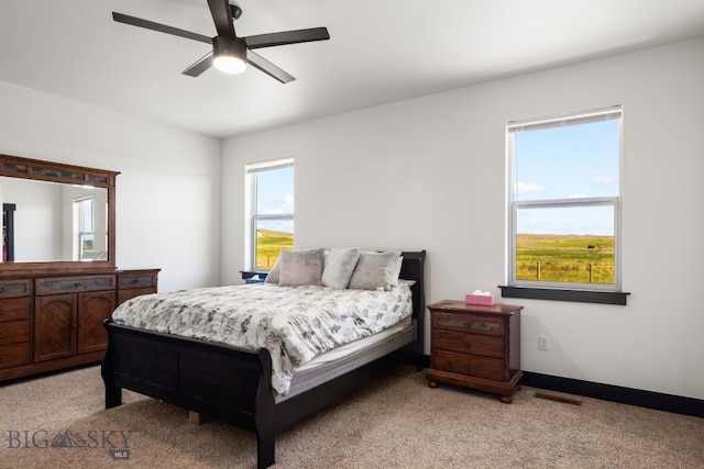 30 Blue Stem Way, Three Forks, MT 59752 - bedroom with light carpet, a ceiling fan, and baseboards