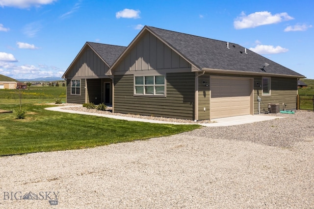 30 Blue Stem Way, Three Forks, MT 59752 - view of front facade with board and batten siding, an attached garage, central air condition unit, gravel driveway, and roof with shingles