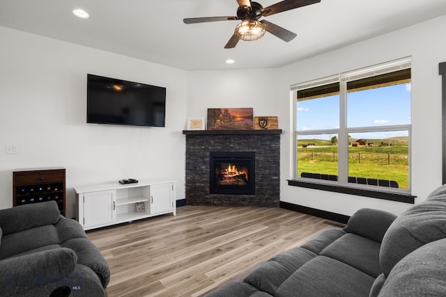 30 Blue Stem Way, Three Forks, MT 59752 - living room featuring a fireplace, ceiling fan, recessed lighting, wood finished floors, and baseboards