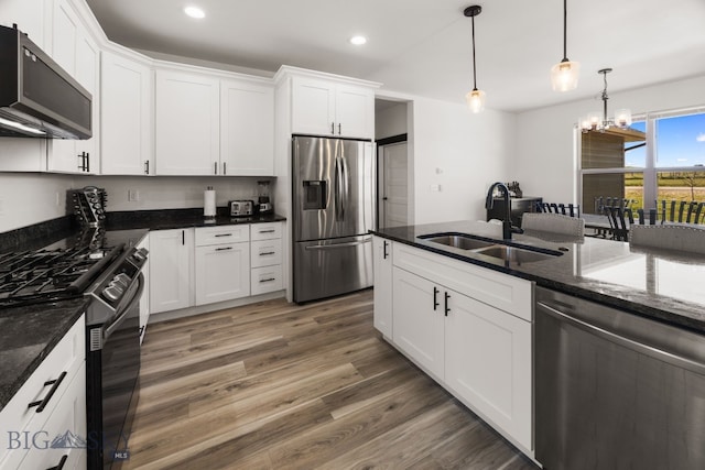 30 Blue Stem Way, Three Forks, MT 59752 - kitchen with stainless steel appliances, a sink, recessed lighting, light wood-style floors, and white cabinets