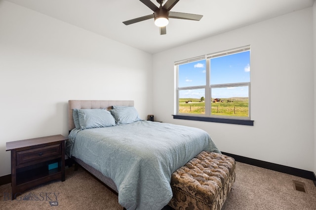 30 Blue Stem Way, Three Forks, MT 59752 - carpeted bedroom with baseboards and a ceiling fan