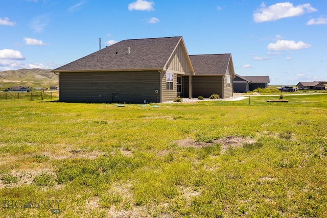 30 Blue Stem Way, Three Forks, MT 59752 - view of side of property featuring board and batten siding, a lawn, and a mountain view