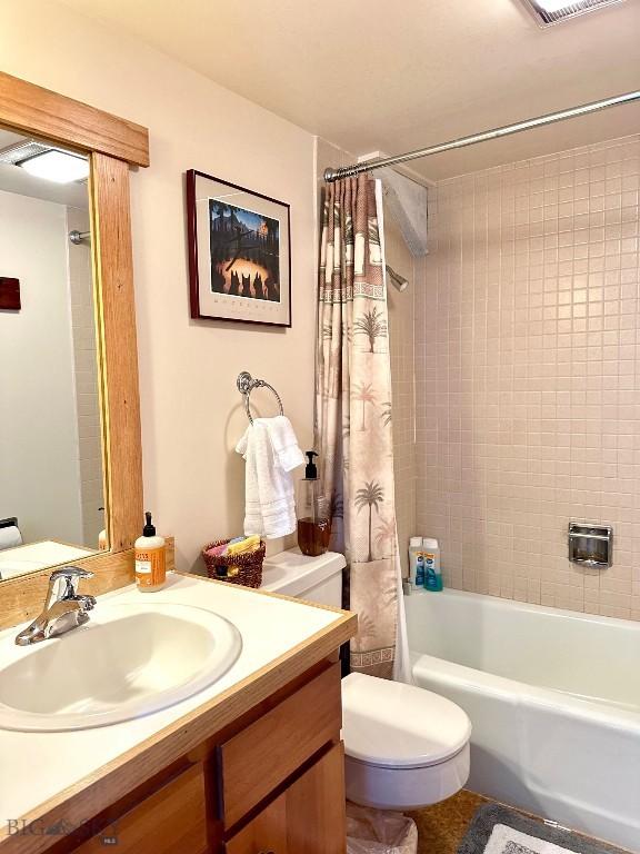 2225 Black Otter Rd Unit 23, Big Sky, MT 59716 - bathroom with toilet, vanity, and shower / bath combo