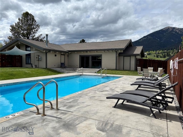 2225 Black Otter Rd Unit 23, Big Sky, MT 59716 - community pool with a mountain view and a patio area