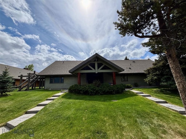 2225 Black Otter Rd Unit 23, Big Sky, MT 59716 - view of front of home featuring a front lawn, stairs, and a shingled roof